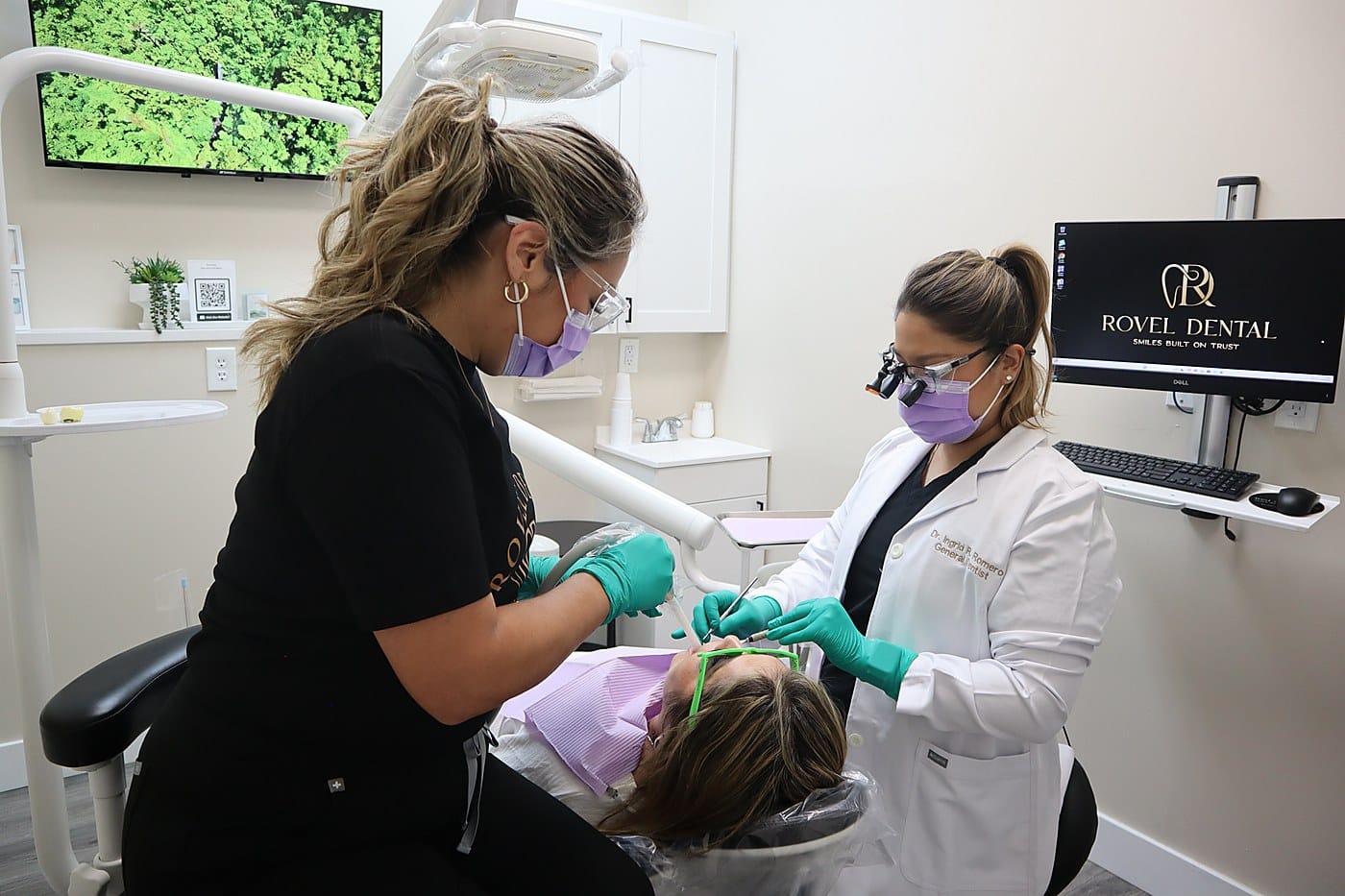 Dr. Ingrid R. Romero, DMD, and her team caring for a patient at Rovel Dental in Palm Springs, FL